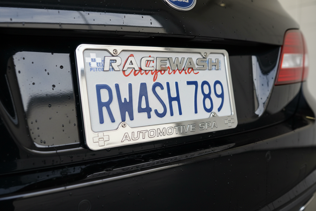 Close-up of RaceWash style license plate frame on clean rear bumper